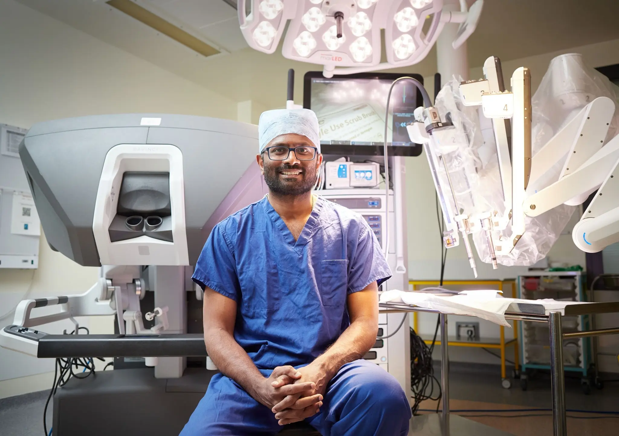 Professor Irshad Shaikh with a surgical robot